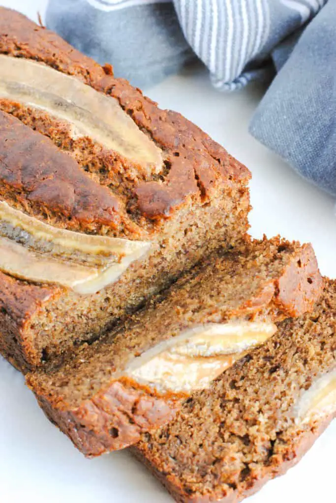 slices of whole wheat banana bread on a light background