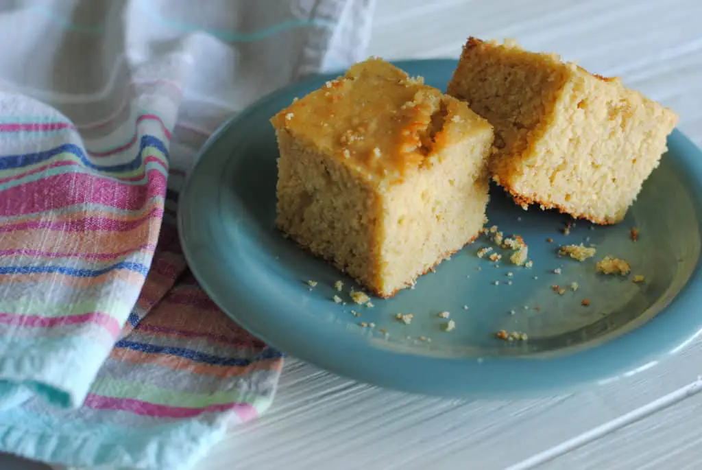 whole grain cornbread on teal plate