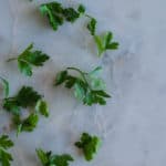 parsley on marble cutting board