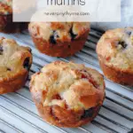 mixed berry muffins on cooling rack with text