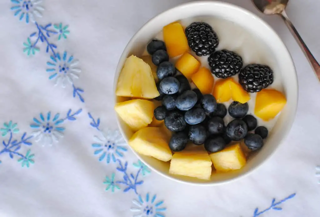 mangoes, blueberries, blackberries, pineapple - over yogurt