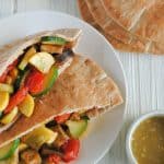 mediterranean veggie pitas on white plate