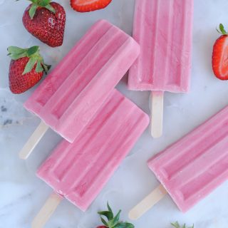 strawberry yogurt popsicles on light background