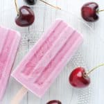 cherries and popsicles on a white background