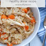 a bowl of chicken and rice with carrots on a white background with gray striped cloth and fork next to bowl. with text stating chicken & rice healthy dinner recipe neveranythyme.com