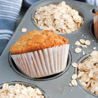 cinnamon oatmeal muffin and oats in muffin tin